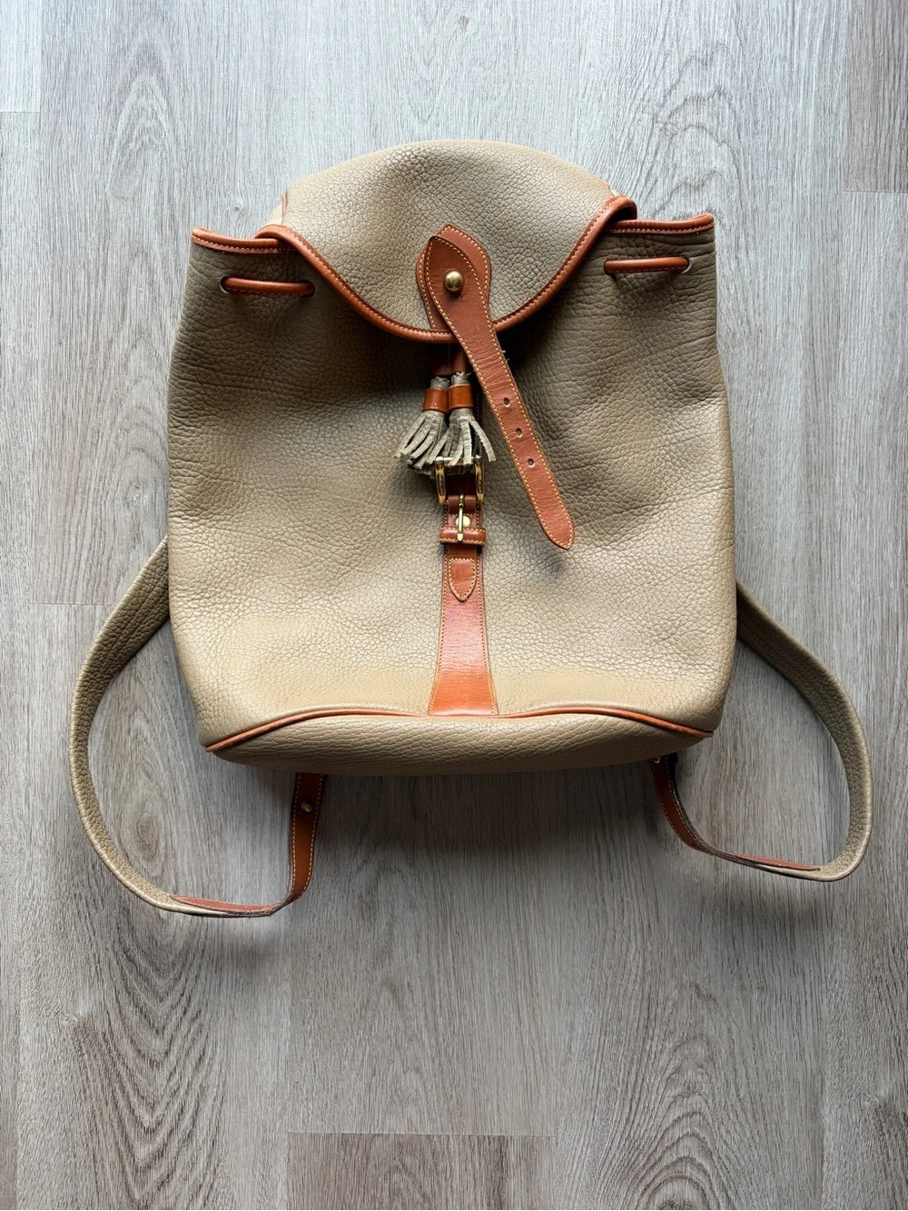 Dooney & Bourke Beige Leather Drawstring Backpack with Tan Trim